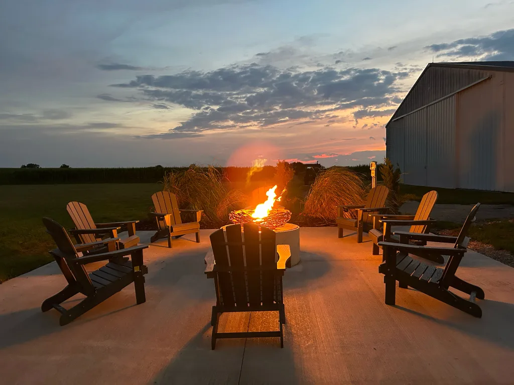 Patio firepit lit up at night